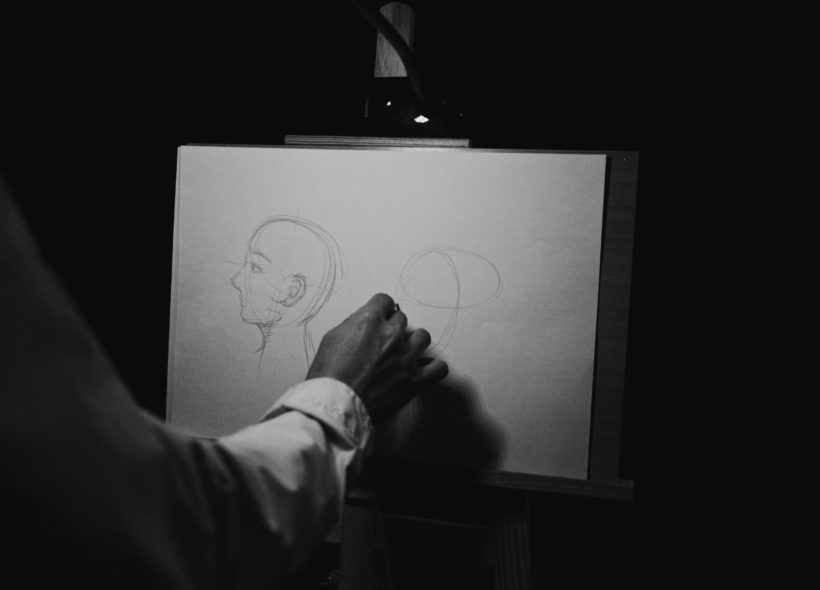 Person drawing a face