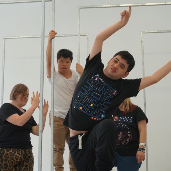 Group of dancers responding to objects and space. 