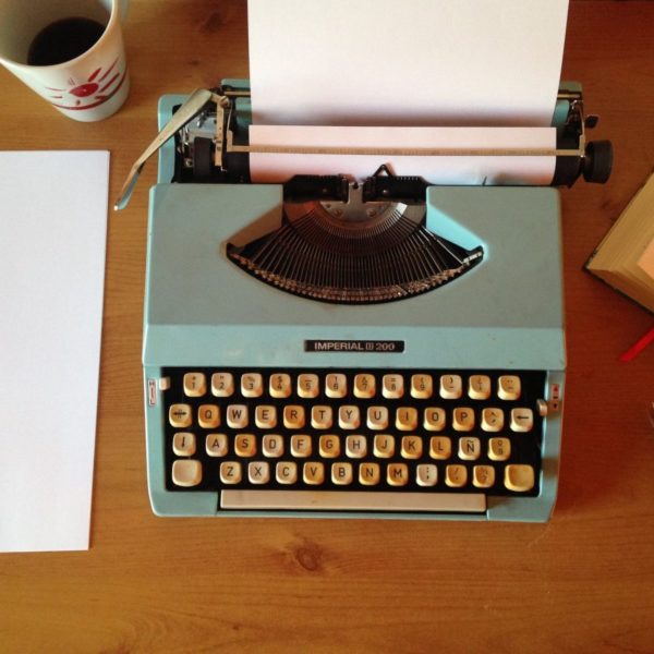 old typewritter and cup of coffee