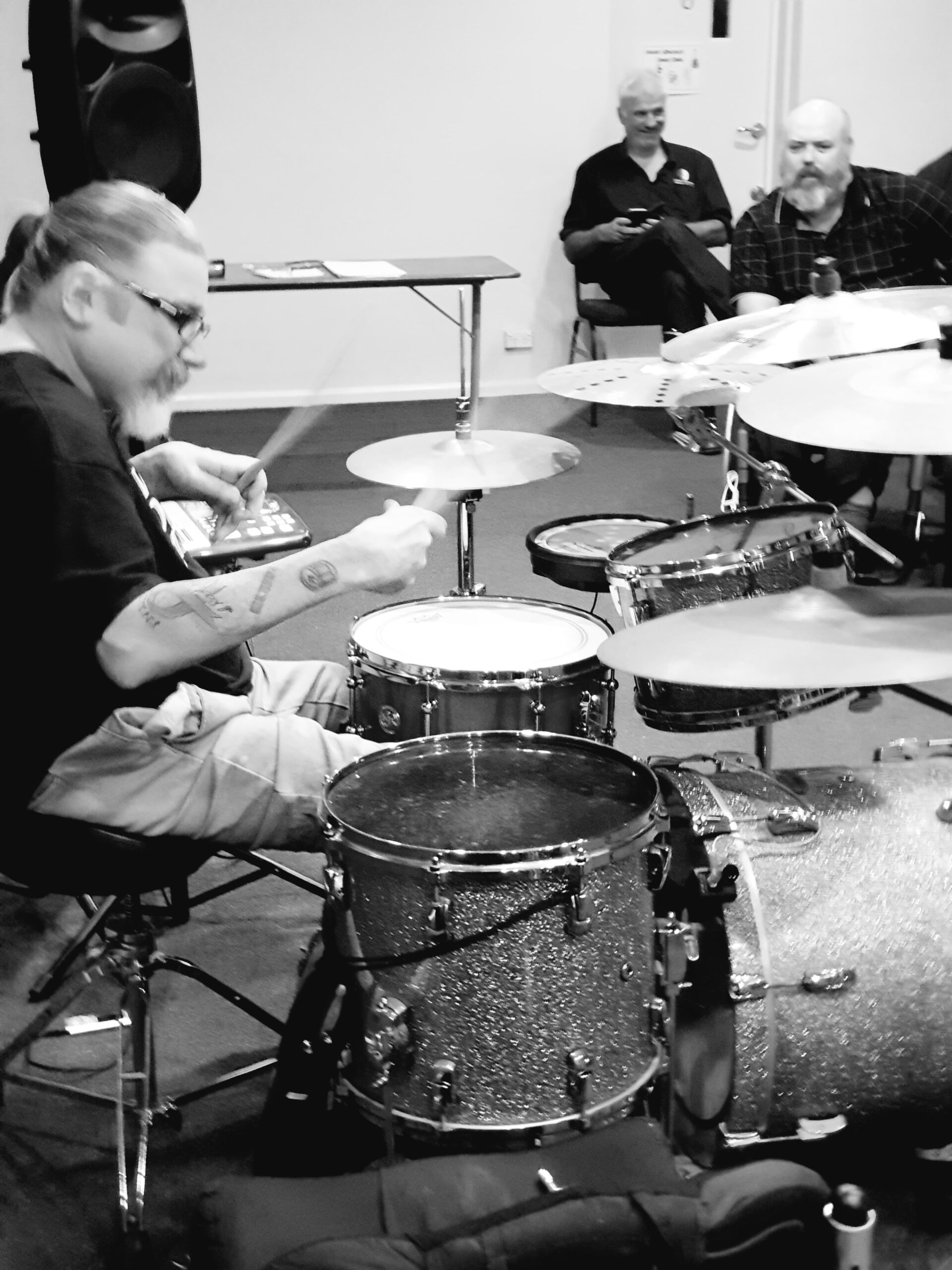 Andrew Hewitt wheelchair drummer performing behind a drum kit