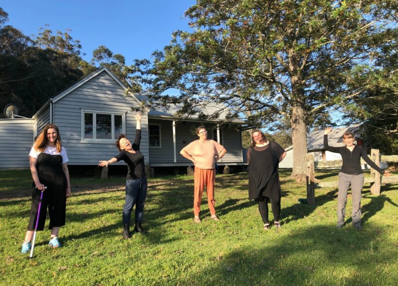 2020 Bundanon Residency Program participants. Five women of various ages and cultural backgrounds standing in front of a cabin in the bush.