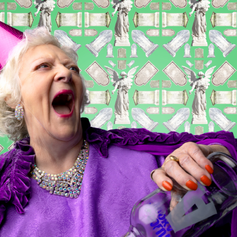 Elderly lady wearing a purple party hat, holding a bottle of vodka and laughing. 