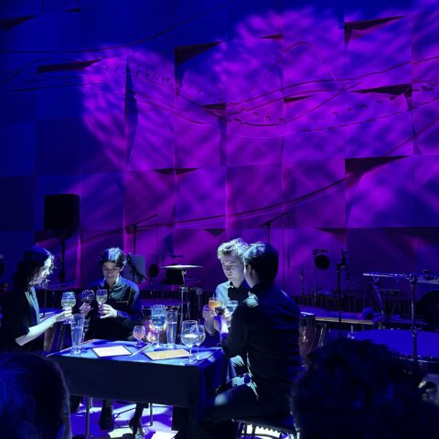 four musicians playing percussion instrument around a table on stage at Melbourne Recital Centre