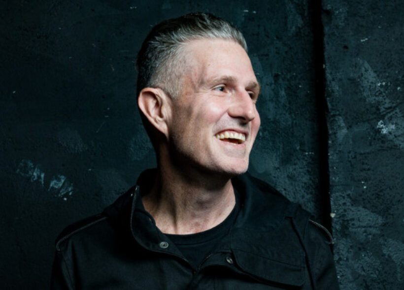Headshot of Wil Anderson smiling off camera.