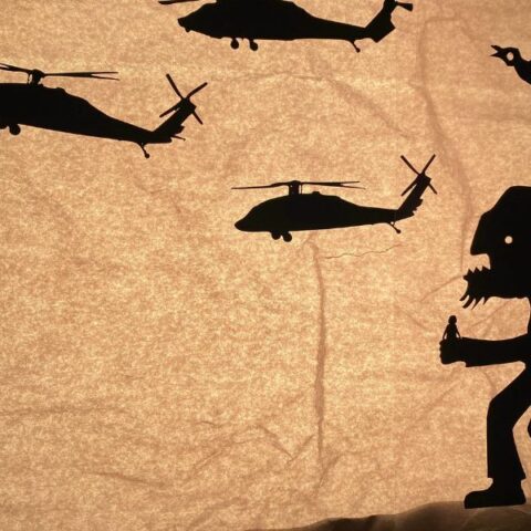 Parchment paper design of a giant on a hill surrounded by helicopters and birds.