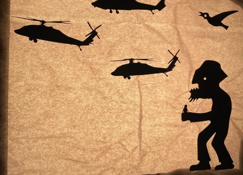 Parchment paper design of a giant on a hill surrounded by helicopters and birds.