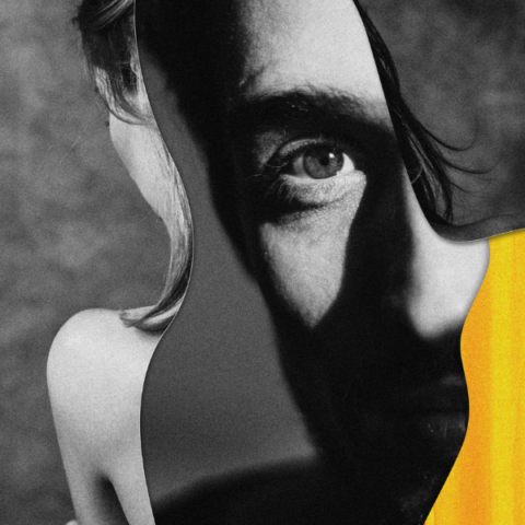 A black-and-white abstract portrait featuring a man’s face partially blended with a distorted outline of a human form, accented by bold orange-yellow streaks