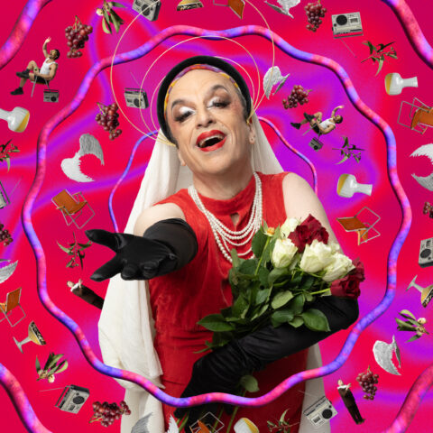 Paul Capsis—Australian theatre icon—wears opera gloves and a dress in drag—he looks like a cross-between the Virgin Mary and Maria Callas. He holds a bouquet of roses and stands against a warped pink and purple graphic background.