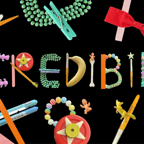 The word 'Incredibilia' is made up of stationery and is surrounded by various items. 