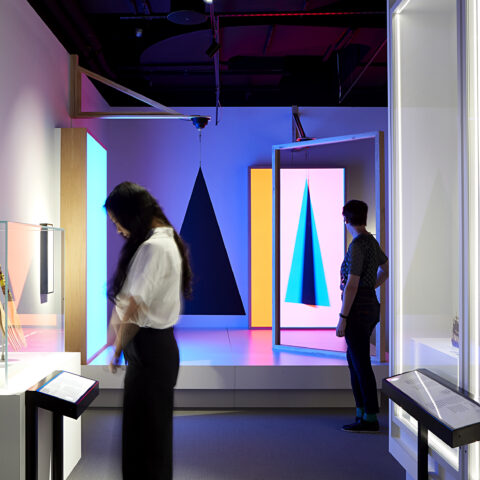 Two visitors standing in The Story of the Moving Image, ACMI's permanent exhibition