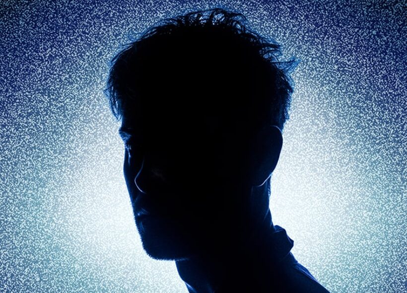 silhouette of man in front of gradient background