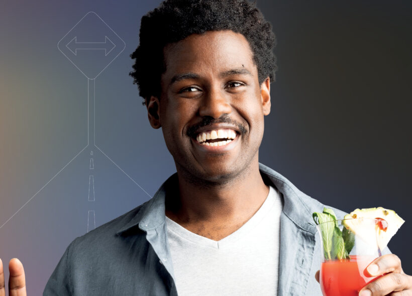 man holding cactus smiling