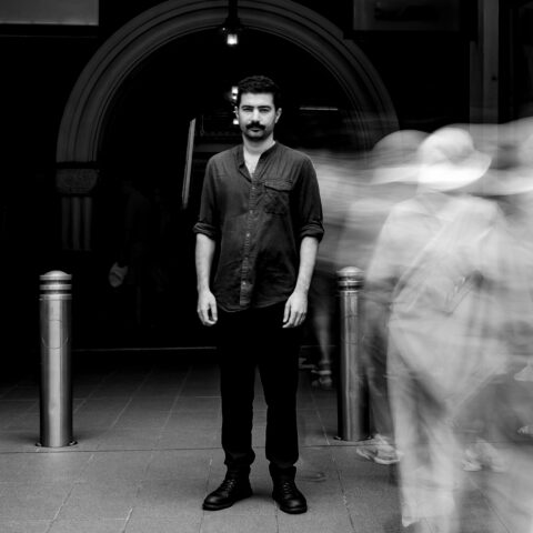 Hamed Sadeghi standing in front of an arched entrance