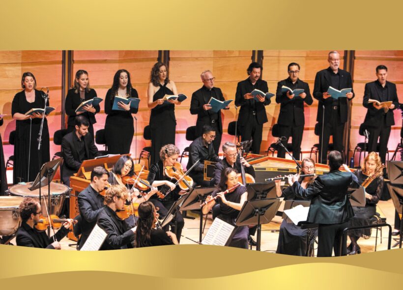 a choir performs behind an orchestra on stage 