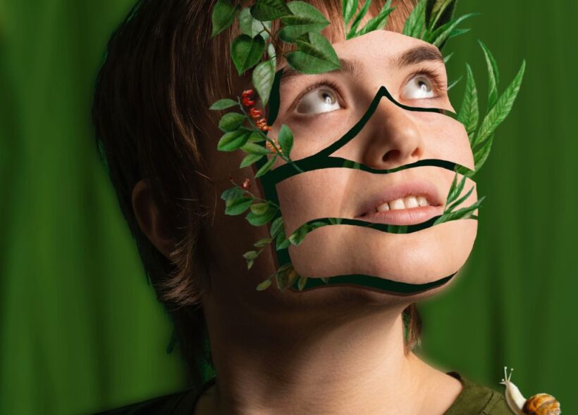 A person with brown hair wearing a green t-shirt gazes towards the top right corner. Their face has been cut out like a collage and green plant leaves poke through the gaps. There is a snail on their right shoulder.
